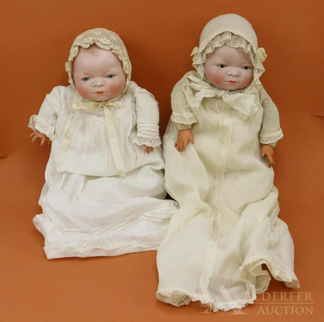 BYELO BABY LOT.: Pair of dolls with 12 1/4" circ. bisque heads. Both dolls are marked Copr. by Grace S. Putnam. Both dolls have celluloid hands, original cloth "frog" bodies. BLUE eye doll has darker hair. Her body is