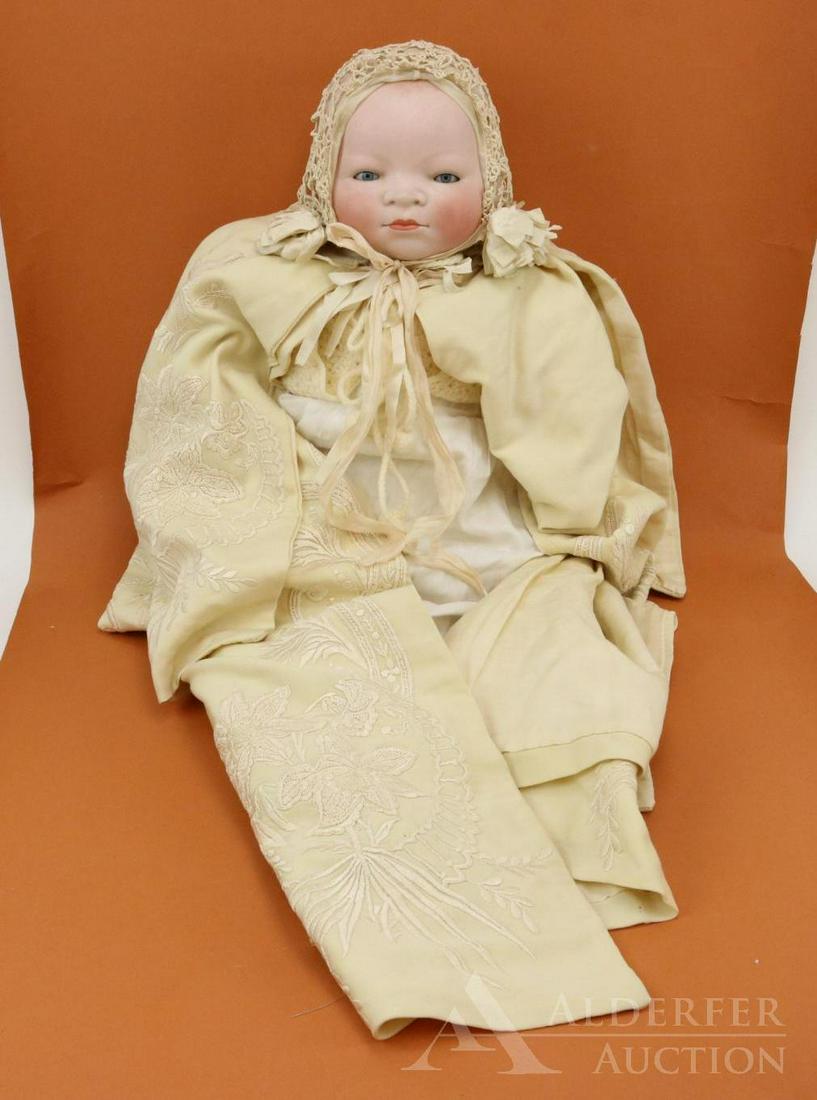 BYELO BABY LOT.: 16 1/2" Circ. bisque head doll marked Copr. By Grace S. Putnam Made in Germany. BLUE eyes, celluloid hands, newer cloth "frog" body. Dressed in beautiful antique baby's long wool coat with heavy silk 