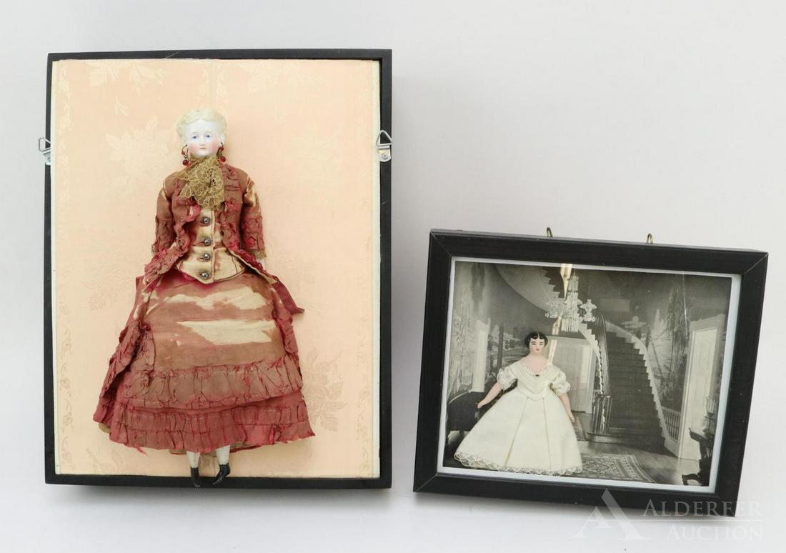 LOT OF CHINA/PARIAN DOLL(S).: Pair of dolls in framed cases. 12 1/2" Parian shoulder head doll with blonde centerpart hair and molded bun. She has a beautiful face. Blue eyes, pierced ears and glass earrings. Cloth body with paria