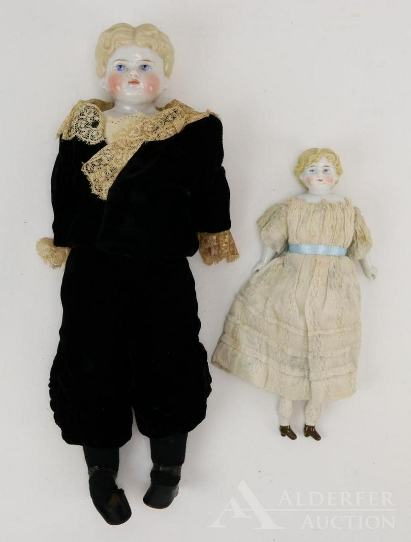 LOT OF CHINA/PARIAN DOLL(S).: Pair of china shoulder head dolls with blonde hair, blue eyes. 11 1/2" Doll is marked 1946 - 6 X 0? and has a center part slightly off center. Antique cloth body, parian lower limbs. Antique clothing.