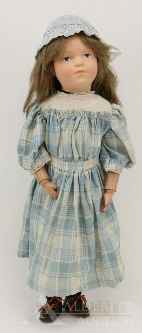 SCHOENHUT LOT.: 21 1/2" Model No. 308C/405. Doll has the decal on back of torso. Replaced long brown human hair wig. Dressed in antique/vintage clothing, brown leather shoes. Stand. Condition: head has been completel