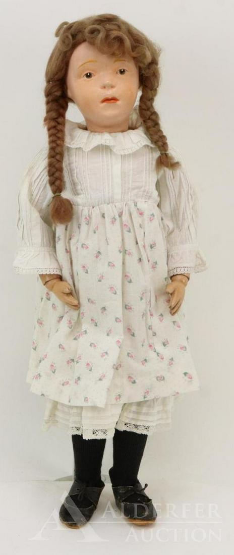 SCHOENHUT LOT.: 20" Model No. 407. Doll has the incised mark on the back of torso. Replaced brown mohair braided wig. Brown integlio eyes. Dressed in antique/vintage clothing. Black leather shoes. Condition: head has