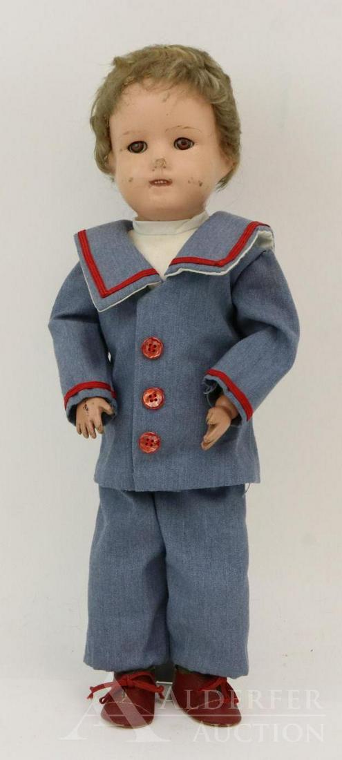 SCHOENHUT LOT.: 15" Model No. 317. Doll has the decal on the back of the torso. Brown SLEEP eyes, open mouth with four teeth showing. Replaced honey blonde mohair wig. Dressed in newer sailor suit, red oilcloth shoes