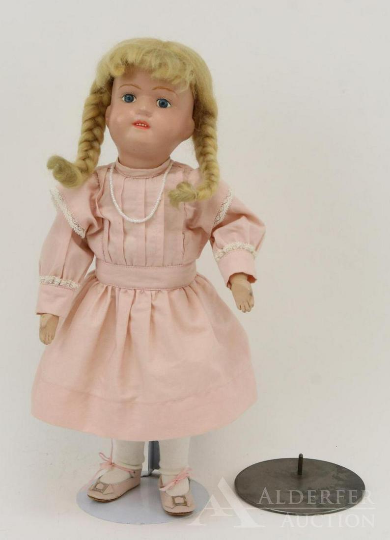 SCHOENHUT LOT.: 15" Model No. 316. Doll has decal on back of torso. Blue painted eyes, open mouth with four teeth showing. Replaced honey blonde braided mohair wig. Dressed in vintage reproduction Schoenhut dress, un