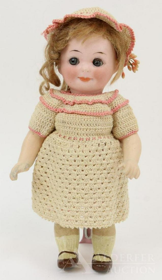 GERMAN BISQUE DOLLS, UNDER 12".: 7 1/2" A.253.M. NOBBI KID REG. USA PAT.OFF. GERMANY 11/0 Googly eye doll. Blue sleep eyes with watermelon smile. Brown mohair wig. 5 Pc. papier mache body with painted brown 1-strap shoes, socks. Dres