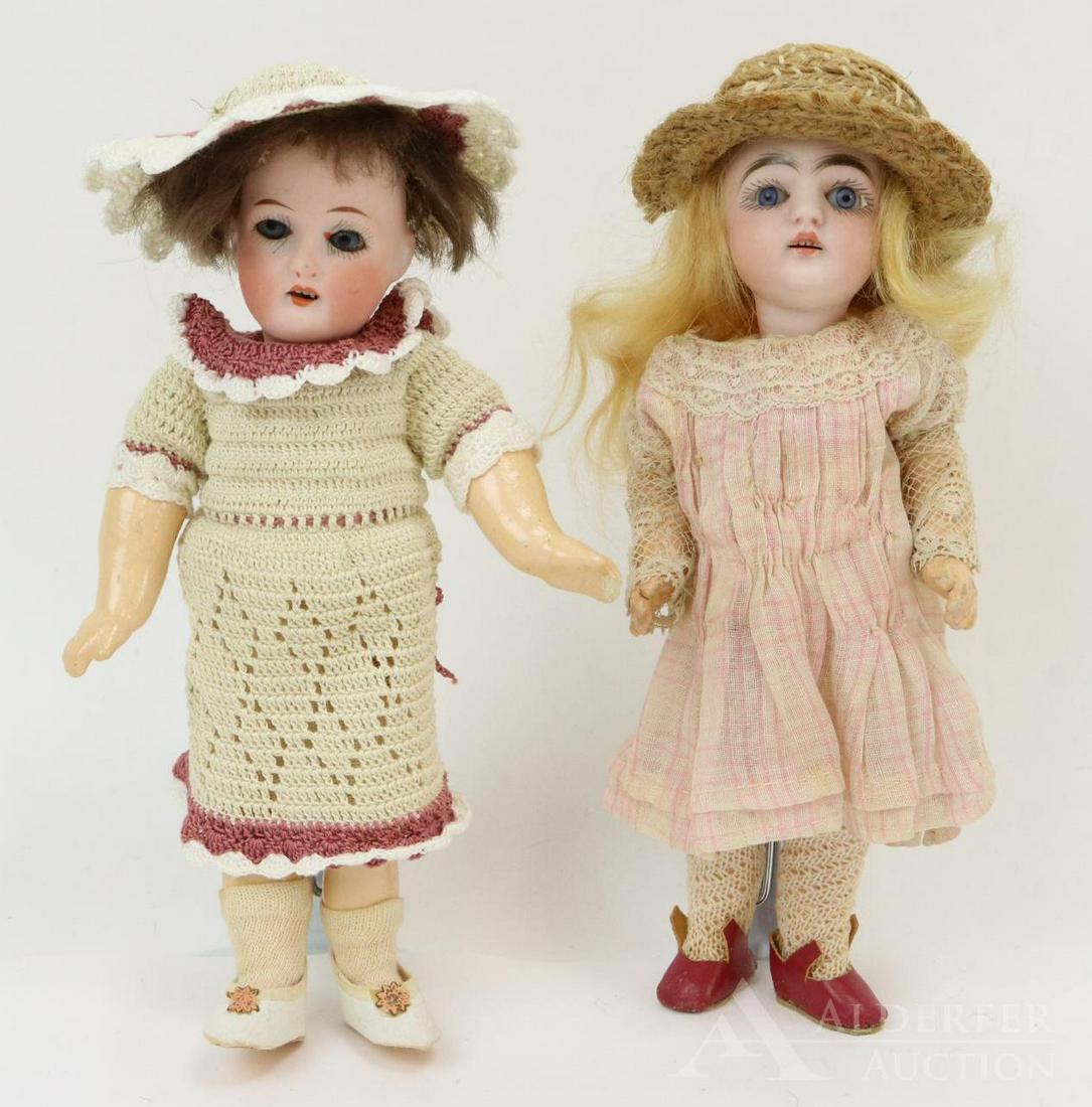 GERMAN BISQUE DOLLS, UNDER 12".: Pair of dolls. Both 7" dolls have blue sleep eyes, open mouths, mohair wigs. They are both wearing shoes/socks. Doll 1) marked MADE IN GERMANY JDK 149. Papier mache body has 1 pc. arms but jointed leg