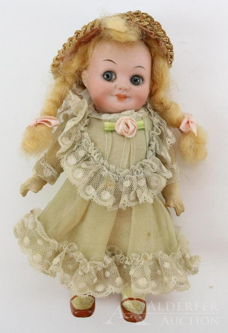 GERMAN BISQUE DOLLS, UNDER 12".: 7" GERMANY 323. A.11/0.M. Googly eye doll. Stationary blue eyes, watermelon mouth, blonde braided mohair wig. 5 Pc. papier mache body with painted 1-strap rust shoes, ivory socks. Dressed in vintage c