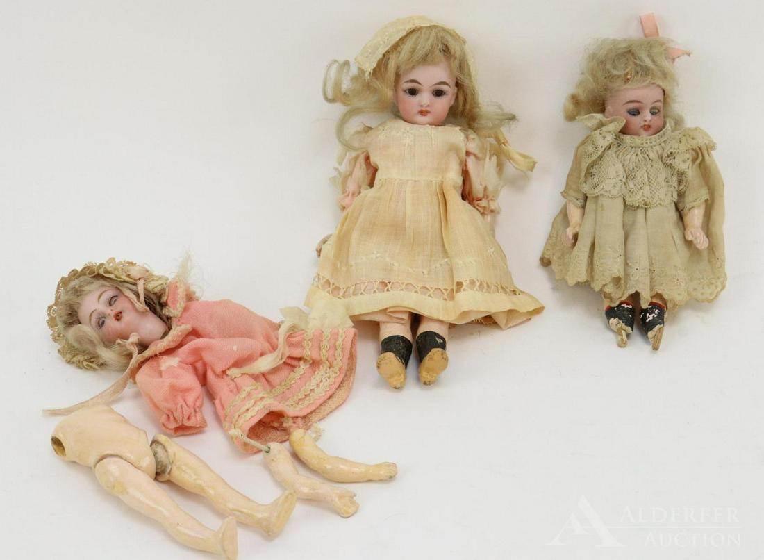 GERMAN BISQUE DOLLS, UNDER 12".: Original family owned lot. Lot of (3) dolls. All of the dolls have sleep eyes, open mouths, blonde mohair wigs. 5 Pc. papier mache bodies. They are all wearing antique clothing. 7" Doll is marked 293