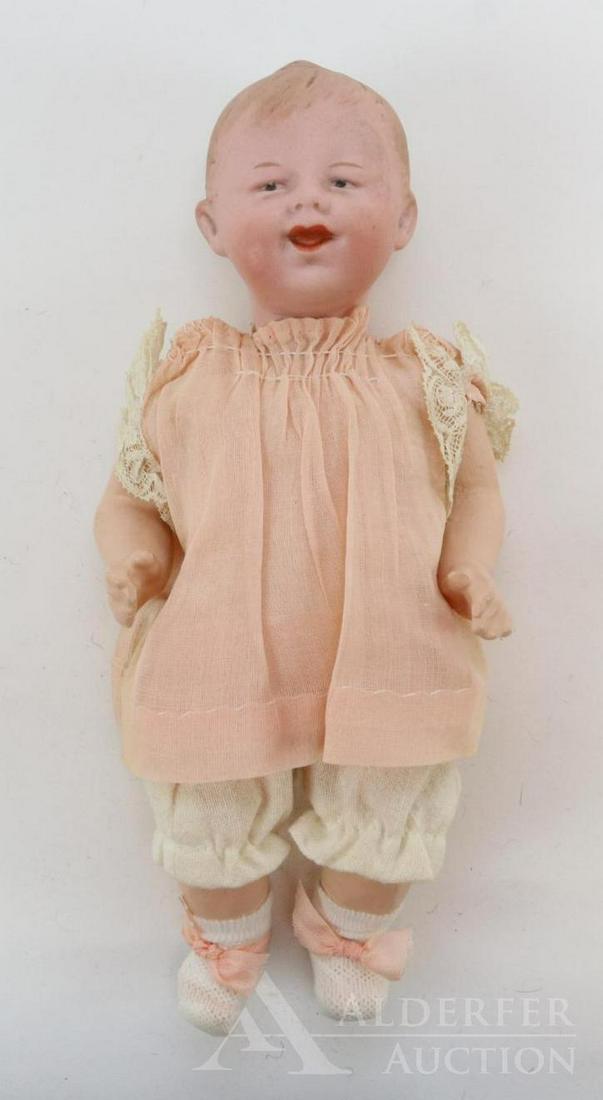 GERMAN BISQUE DOLLS, UNDER 12".: 9" 2/0 (79)HEUBACH square 11 GERMANY grinning character baby. Blue integlio eyes, open/closed mouth, molded/painted blonde hair. 5 Pc. papier mache baby body. Dressed in antique pink organdy dress, pe