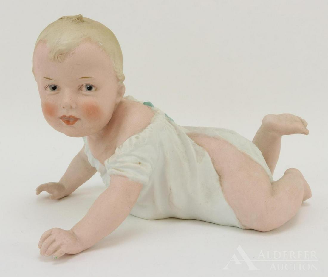 BISQUE FIGURINE LOT: 8" T x 11" L HEUBACH crawling piano baby marked 3101 with Heubach sunburst. Blue integlio eyes. Condition: nothing observed on bisque.