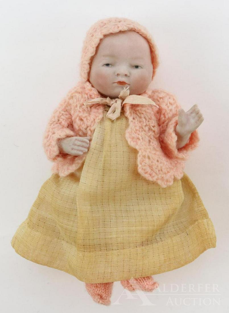 LOT OF ALL BISQUE DOLL(S).: 6 1/2" 31/15 COPYRIGHT GERMANY .(Byelo Baby). Painted brown eyes and light brown hair. 5 Pc. bent limb baby body. Dressed in pink crocheted sweater and bonnet; knit booties. White cotton dress and und