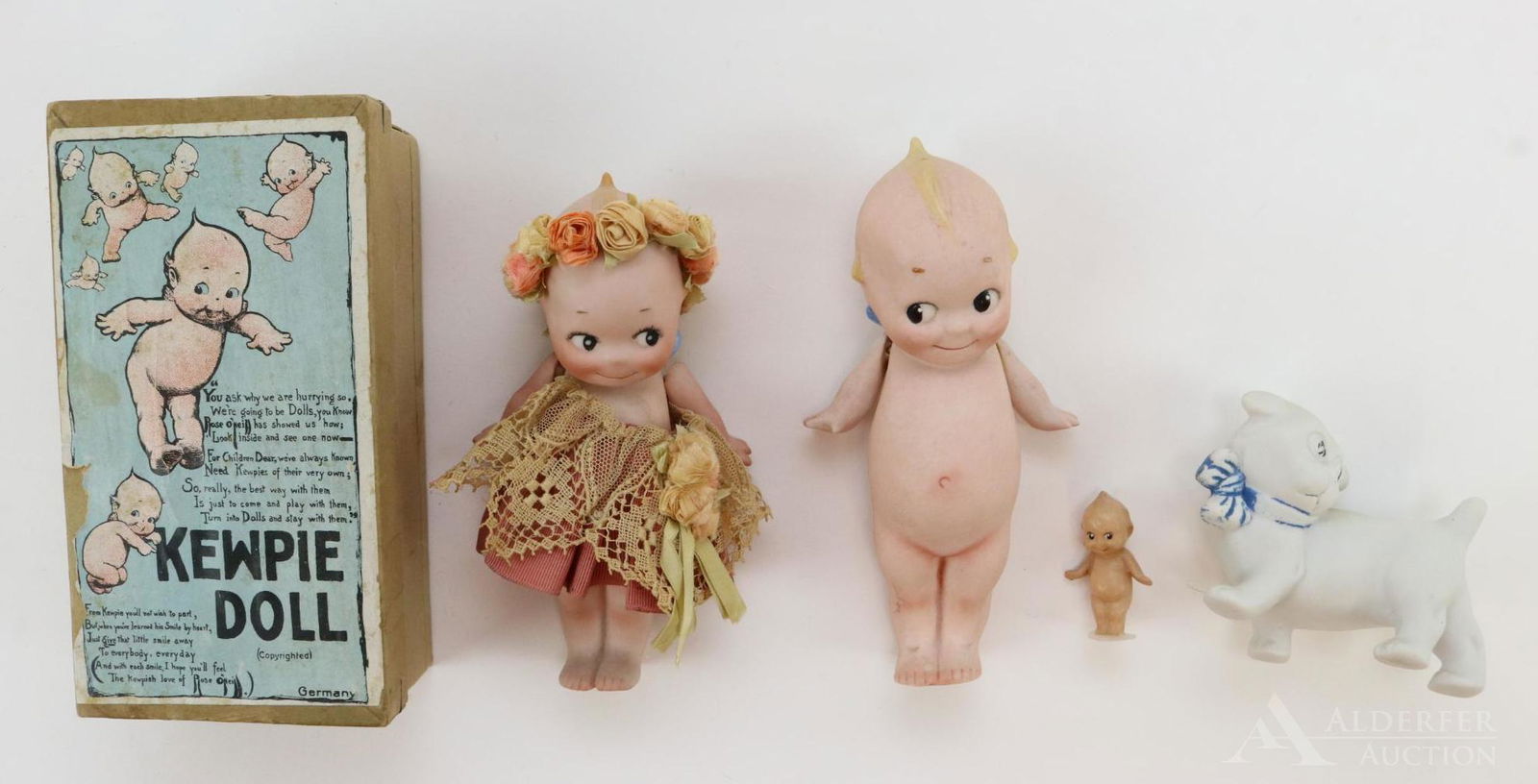 LOT OF ALL BISQUE DOLL(S).: Lot of (3) items designed by Rose O'Neill. 5 1/4" Kewpie doll in OB. Marked on feet: O'Neill. Strung arms. Doll has been dressed. Box lid reads: GERMANY No. 2/297/4 1/2/0. 5 1/2" Kewpie. Marked on fee