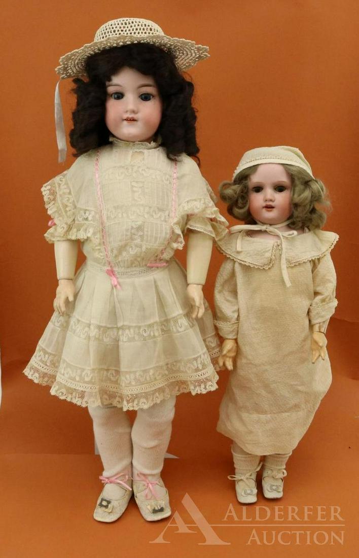 ANTIQUE GERMAN BISQUE HEAD DOLL(S).: Pair of dolls with sleep eyes, open mouths, dressed in antique clothing. Doll 1) 24" MADE IN GERMANY ARMAND MARSEILLE 390n. D.R.G.M. 246/1 A.6.M. Blue eyes, synthetic wig. Papier mache ball jointed bo
