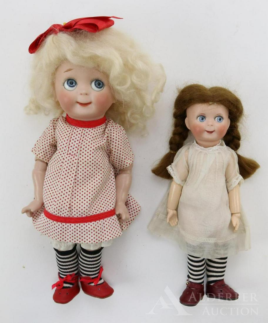 ARTIST DOLL LOT.: Pair of J.D.K. 221 Googly eye bisque head dolls. Doll 1) 9 1/2" has no signature. It has painted side glance eyes, watermelon smile, brown braided mohair wig. Reproduction fully jointed body. Dressed 