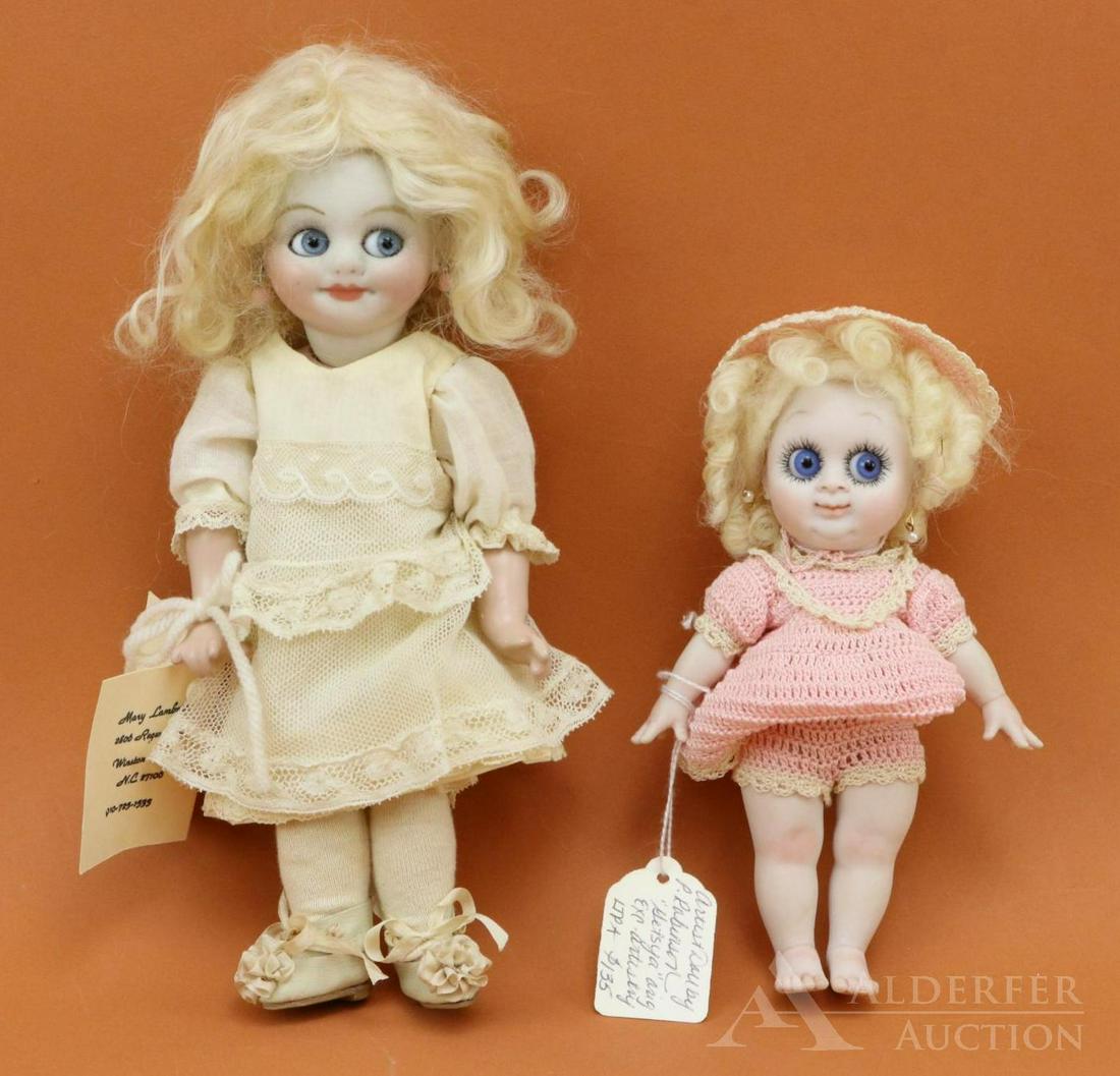 ARTIST DOLL LOT.: Pair of GOOGLY eye bisque head dolls. Both dolls have blue side glance glass eyes. Doll 1) 6 1/2" All bisque doll is marked PLEASED GETSYA and the artist is Pat Robinson. Watermelon type smile, pierce