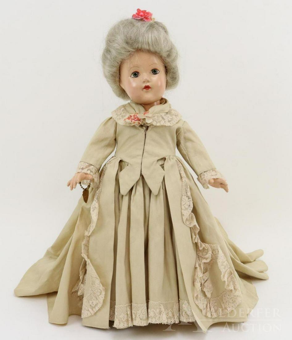 COMPOSITION EFFANBEE HISTORICAL DOLL.: 14" 1939 All original "1760 Pre-Revolutionary Period" doll. Painted blue eyes, gray human hair wig. Ecru cotton period gown, petticoat, pantaloons, ivory oilcloth shoes. Brass heart bracelet. Stand. C