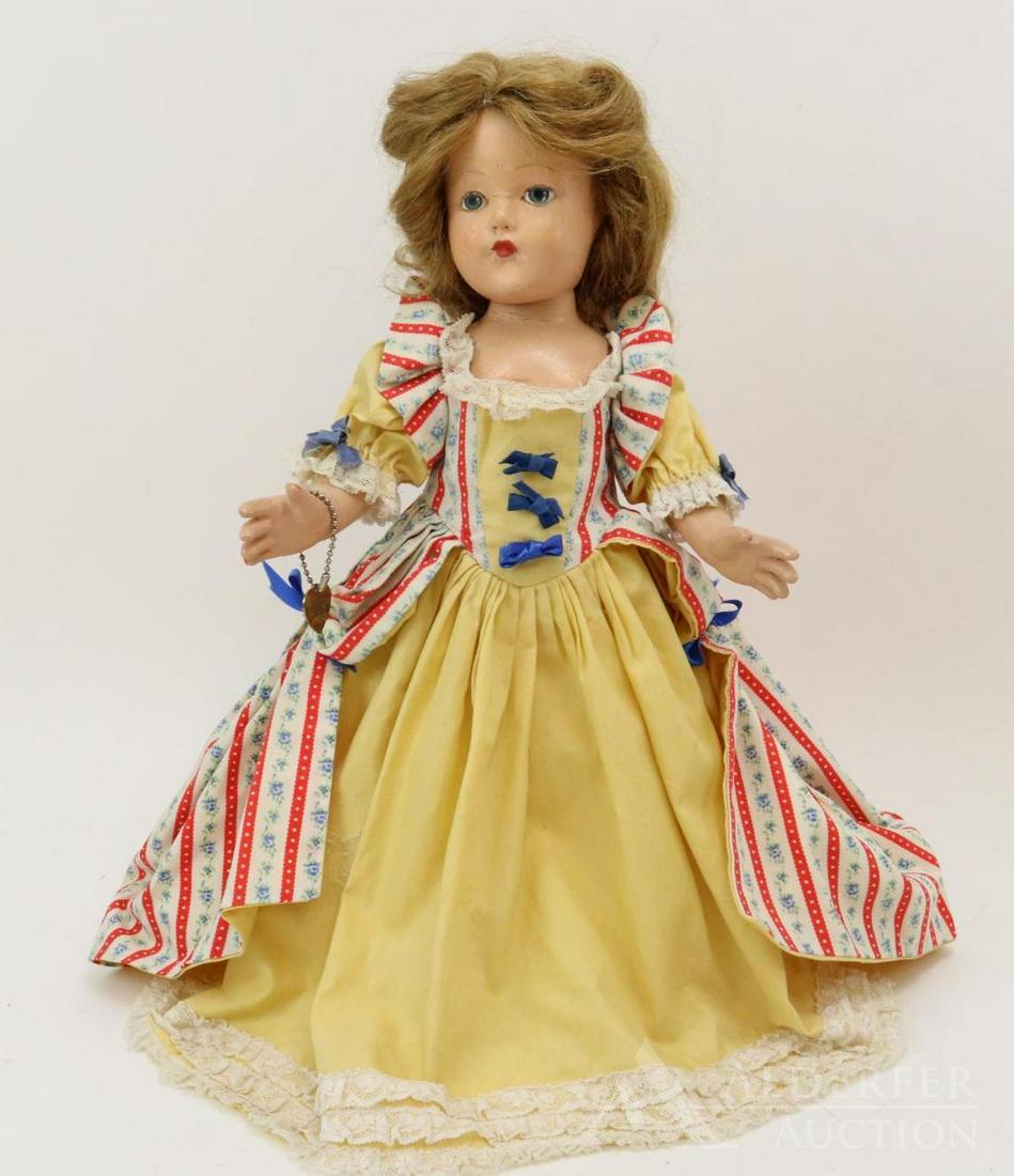 COMPOSITION EFFANBEE HISTORICAL DOLL.: 14" 1939 Original "1685 Later Carolina Settlement" doll. Painted blue eyes, honey blonde human hair wig. Yellow cotton dress with floral print over dress, bodice. (Replaced ribbons.) Original petticoa