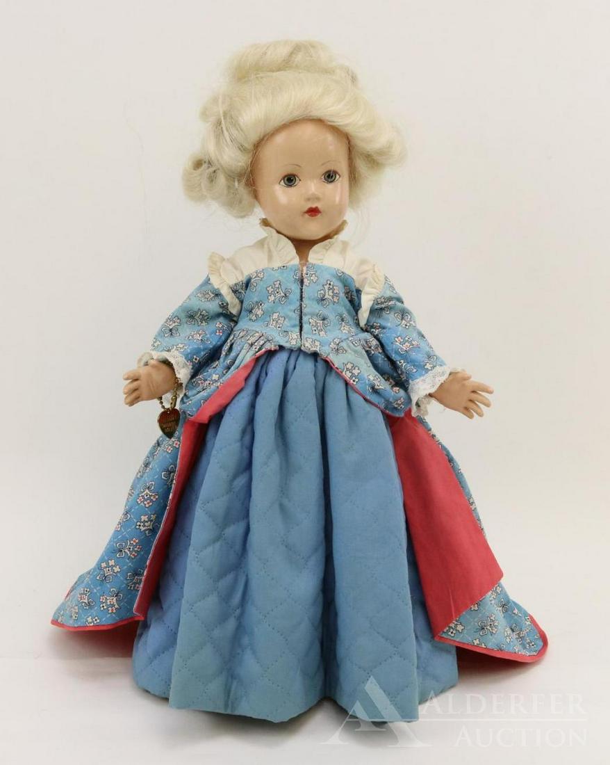 COMPOSITION EFFANBEE HISTORICAL DOLL.: 14" 1939 All original "1750 The Development of Culture" doll. Painted blue eyes, white human hair wig. Blue floral cotton print with coral reverse. Blue quilted under skirt. Petticoat, pantaloons, ivo