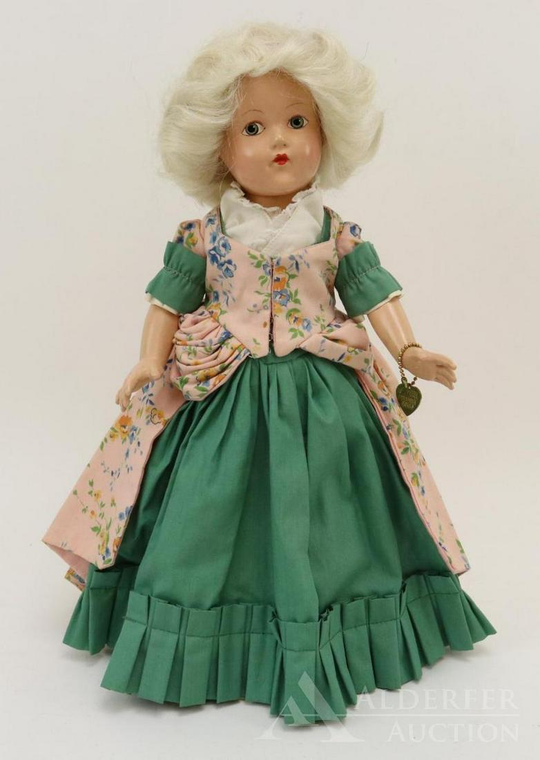 COMPOSITION EFFANBEE HISTORICAL DOLL.: 14" 1939 All original "1777 Revolutionary Period" doll. Painted blue eyes, white human hair wig. Green cotton dress with peach floral over dress. Petticoat, pantaloons, ivory oilcloth shoes. Brass hea