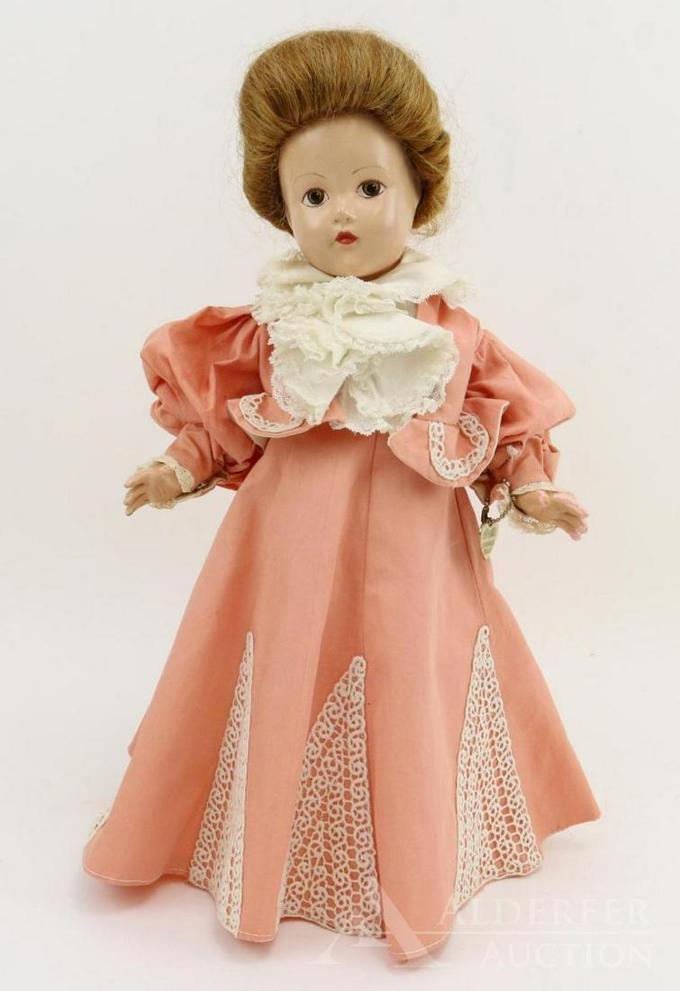 COMPOSITION EFFANBEE HISTORICAL DOLL.: 14" 1939 All original "1896 Unity of Nation Established" doll. Painted brown eyes. Honey blonde human hair wig. Peach cotton dress with separate jacket. Fancy lace bodice. Petticoat, pantaloons. Ivory