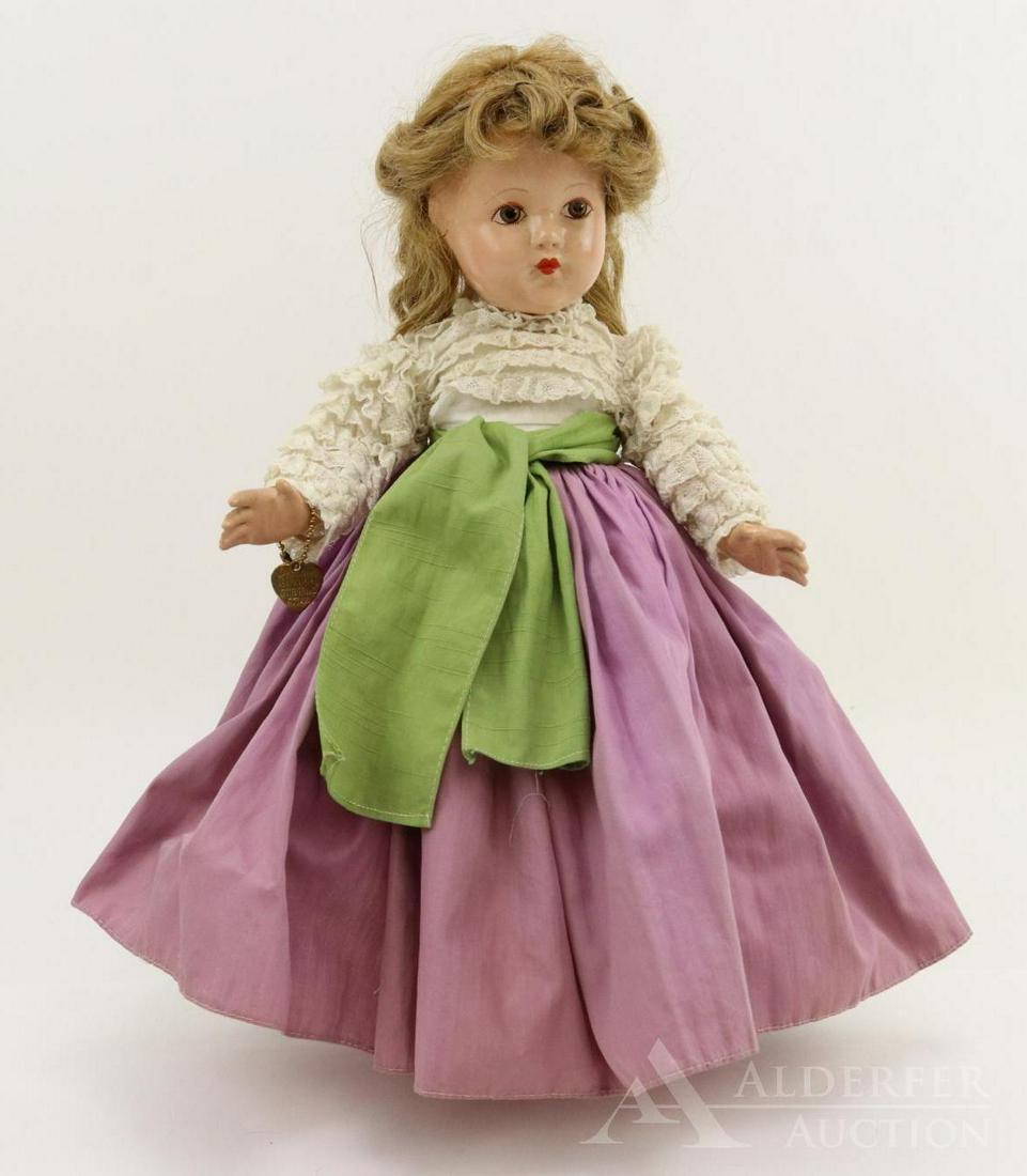 COMPOSITION EFFANBEE HISTORICAL DOLL.: 14" 1939 All original "1939 - Today" doll. Painted brown eyes, honey blonde human hair wig. Lavender cotton skirt with lace covered white bodice. Green cotton sash. Petticoat, pantaloons. Ivory oilclo