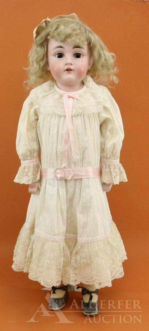 ANTIQUE GERMAN BISQUE HEAD DOLL.: 26 1/2" DEP 154.13 Shoulder head doll. Stationary brown eyes, open mouth, curly blonde mohair wig. Pin jointed leather body with bisque lower arms. Dressed in vintage white cotton clothing - dress wit