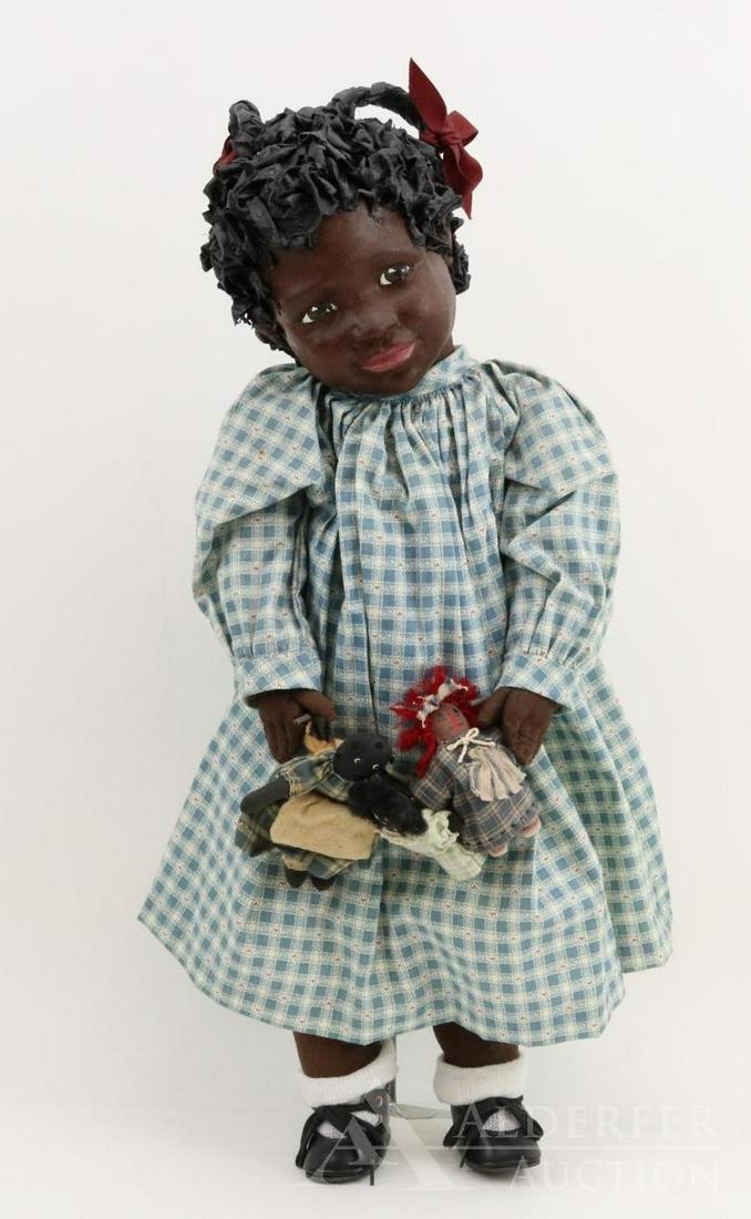 LOT OF ARTIST DOLL(S).: 22" "CAMMIE" II? #1, 1988 by artist Barbara Jane Larsen. Signed on back of neck. Painted cloth head, features and curly hair with braids. Cloth body. She is holding (3) little 4" cloth dolls on a stri