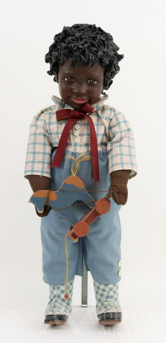 LOT OF ARTIST DOLL(S).: 22" CAMERON" #1, 1988 by artist Barbara Jane Larsen. Signed on back of neck. Painted cloth head, features and curly hair. Cloth body. He is holding a wooden toy horse. Stand.