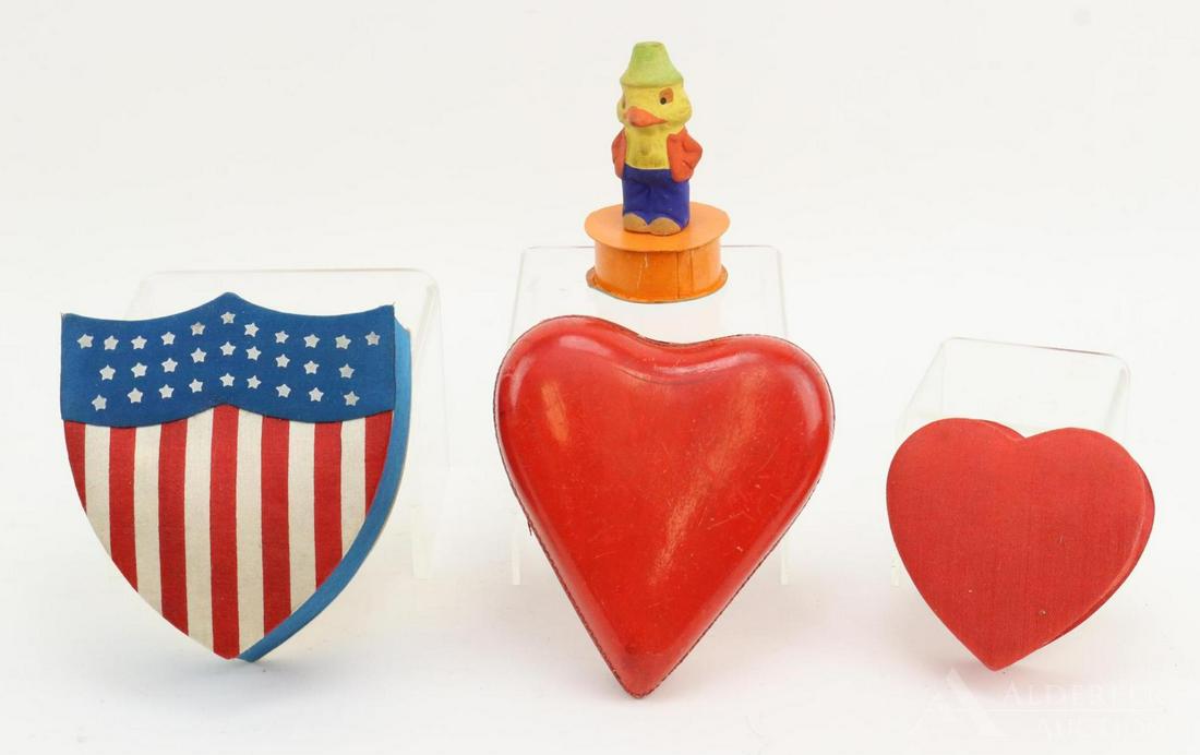 LOT OF HOLIDAY/NOVELTY.: Lot of papier mache holiday candy containers. 3 1/2" Silk satin covered Heart. 5 1/2" Shiny cardboard Heart. 5 1/2" Silk satin covered Patriotic Shield. 4" German Duck standing on orange box. Conditio