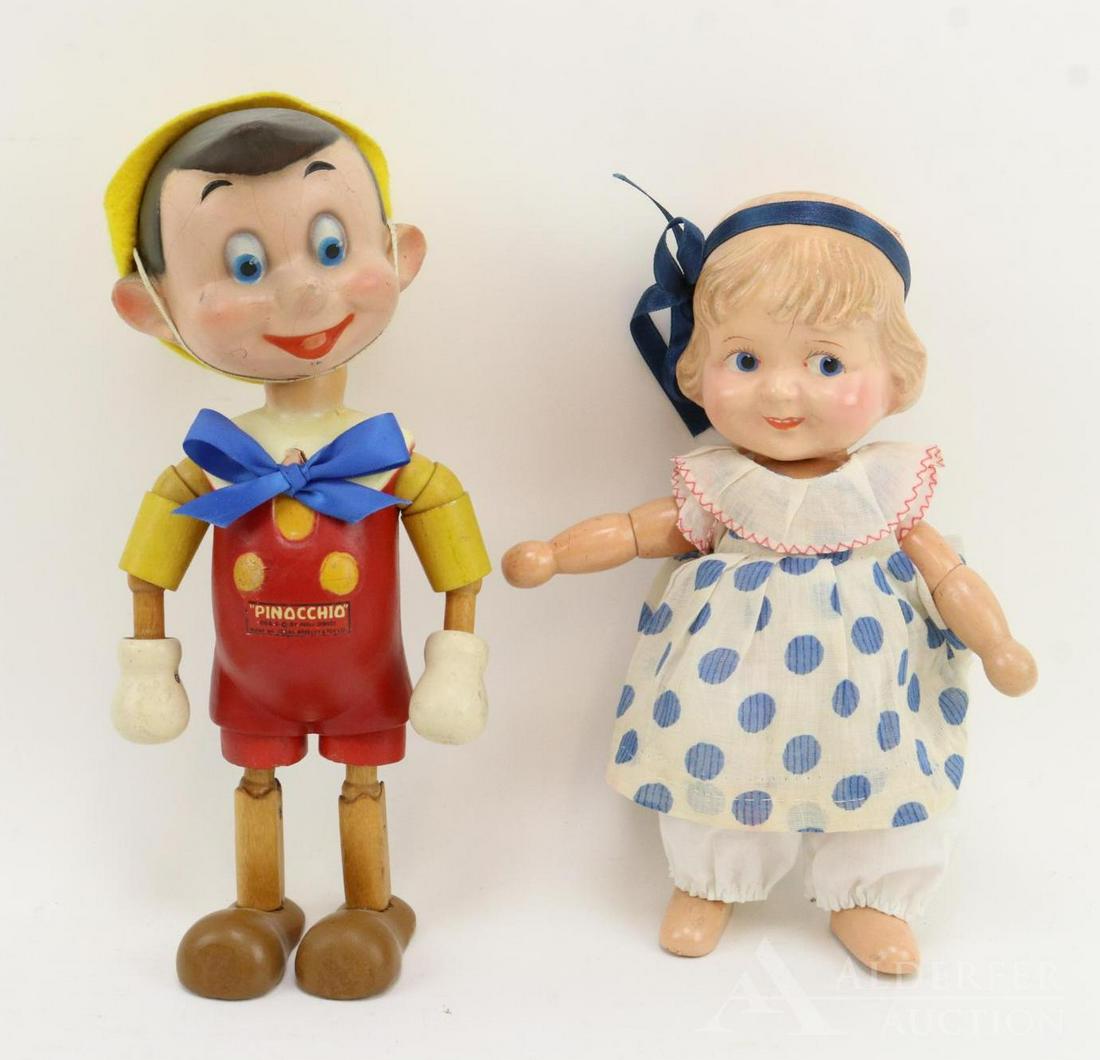 LOT OF COMPOSITION DOLL(S).: Pair of 1930's dolls with wood segmented bodies. 10 1/2" "Pinocchio" doll. Marked (decal) Des. & copyright by Walt Disney, Made by IDEAL NOVELTY & TOY CO. Condition: crazing. Crack under each ear. Pai