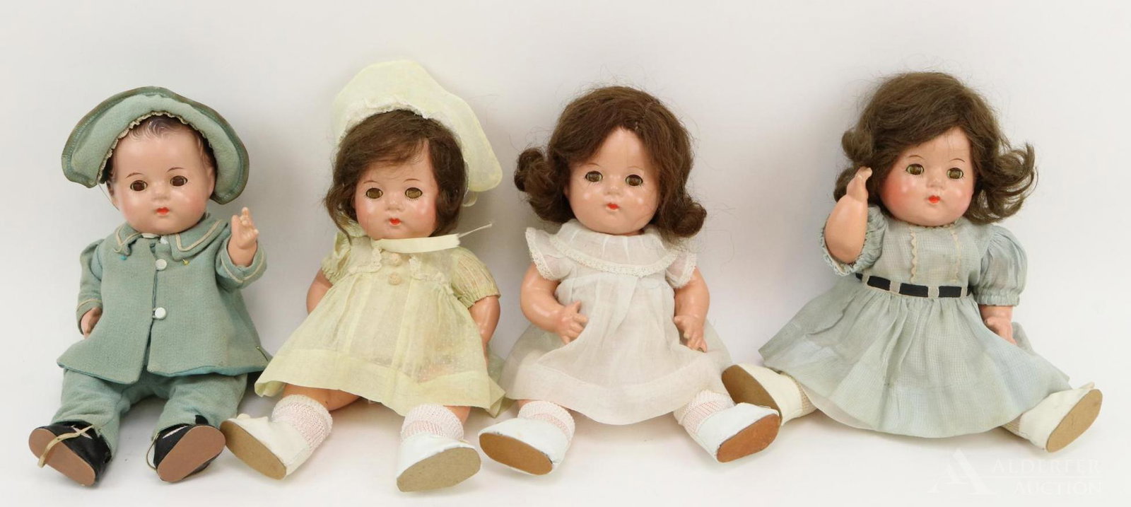 LOT OF DIONNE QUINT DOLLS.: Lot of (4) 11 1/2" composition Madame Alexander dolls. They have the 5 pc. toddler bodies. They have sleep eyes (all of them have lost their color). (3) Have brown human hair wigs, the other has paint