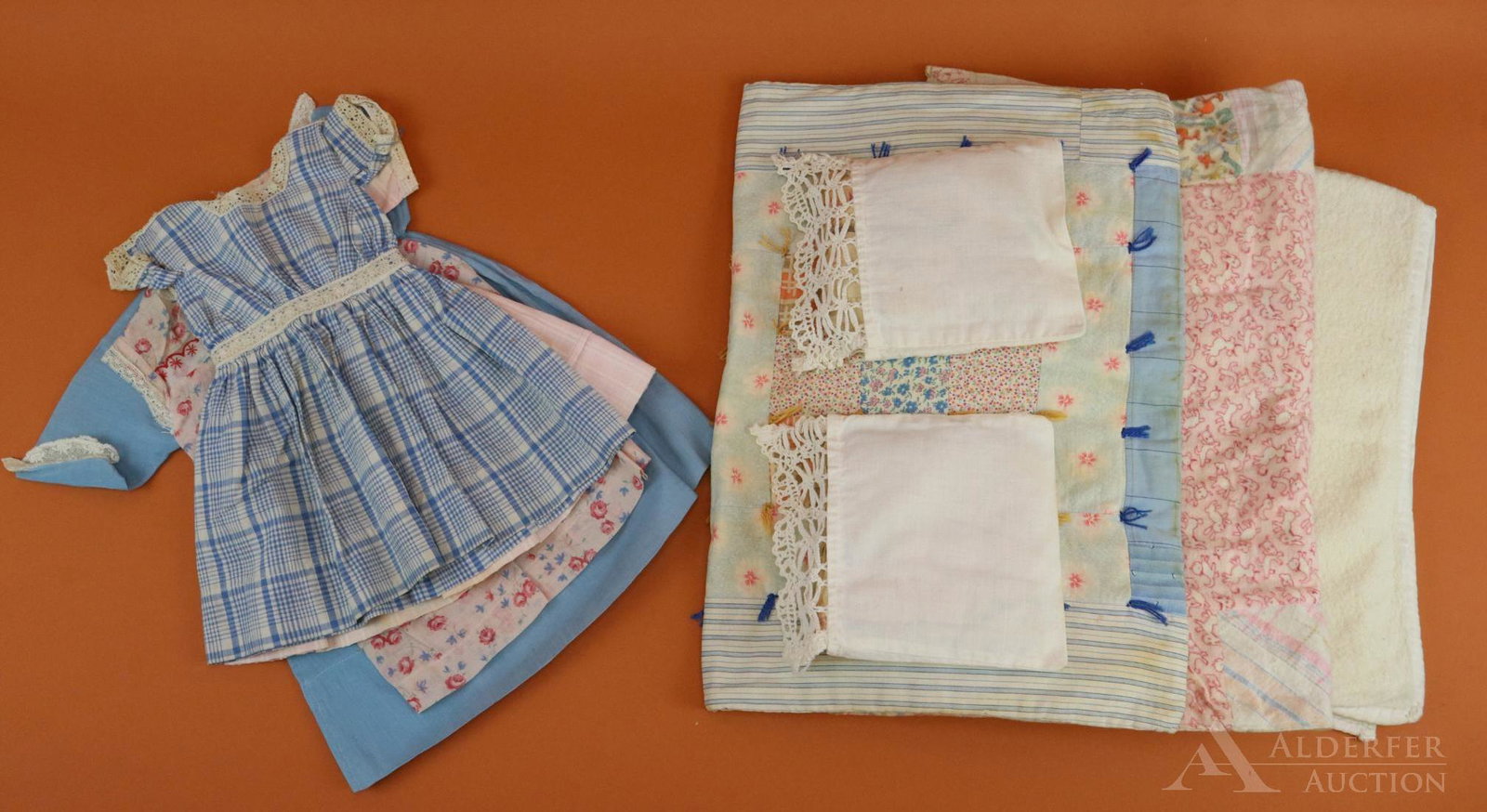 LOT OF ANTIQUE/VINTAGE CLOTHING & LINENS.: Lot of antique doll clothing - (4) dresses: 13" blue/white, 13" pink/white, 14" pink floral, 15 1/2" blue. Bedding - wool baby blanket. 16" x 23 1/2" cotton flannel patchwork quilt. 17" x 23" tied cot