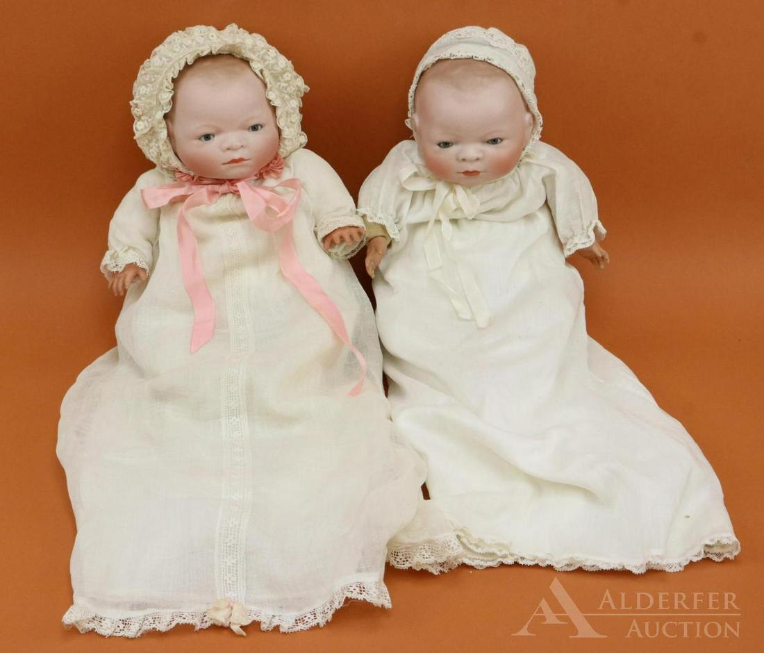 BYELO BABY LOT.: Pair of 14" L, 12 1/2" cir. bisque head dolls marked COPR. BY GRACE S. PUTNAM MADE IN GERMANY. Both dolls have blue sleep eyes, light brown painted hair, celluloid hands . (1) Doll has a cracked palm.