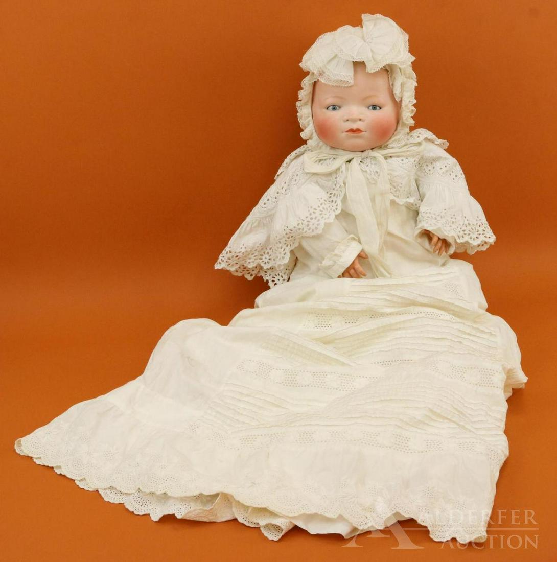 BYELO BABY LOT.: 21" L, 17" cir. Bisque head doll marked COPR. BY GRACE S. PUTNAM MADE IN GERMANY. Blue sleep eyes, light brown painted hair, celluloid hands. Original cloth "frog" body is marked with faint purple sta
