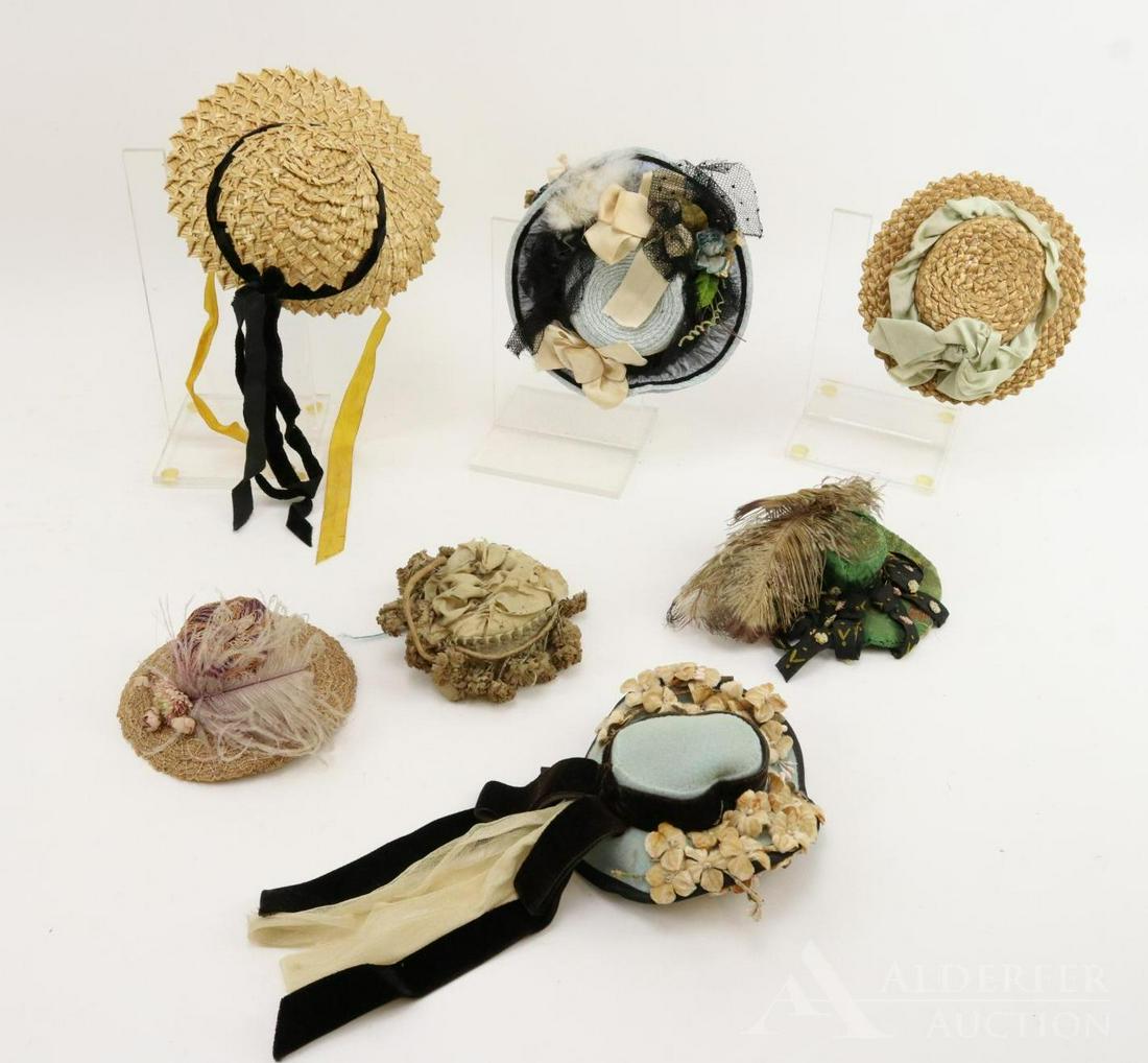 LOT OF ANTIQUE/VINTAGE DOLL HATS.: Lot of (7) hats. Vintage - decorated pale blue straw hat. Antique - pale blue wool felt hat, (3) decorated straw hats, decorated green silk hat, silk and woven hat with fabric flowers. Condition: this