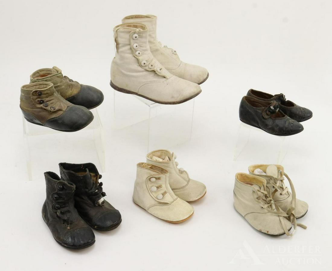 LOT OF ANTIQUE BABY/CHILDREN'S SHOES.: 7" Ivory cloth child's boots. Child's black/ivory shoes 4 3/4". Black leather boot's 4 1/2". (2) Prs. ivory leather baby boots 4", Mrs. Day's Ideal 4". Child's black leather Mary Jane shoes 4 1/2". Co