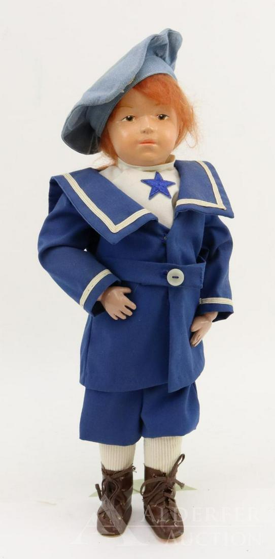 SCHOENHUT LOT.: 14" Model No. 308B? Doll has the oval decal on back of torso. Brown integlio eyes, replaced red mohair wig. No original clothing, dressed in newer 3 pc. sailor suit with knee length pants. Denim hat.