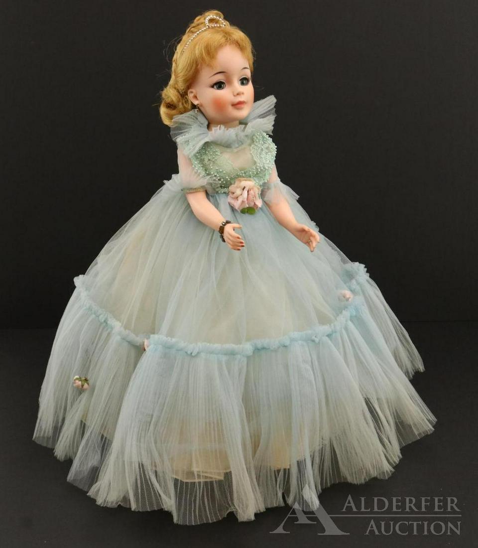 DOLLS OF THE 1950: 21" Madame Alexander "Southern Belle". 1965 Doll dressed in original tagged outfit #2155, blue dress with pleated hem. Rhinestone earrings, bracelet, diamond ring. Pink heels with flowers on toes. Con