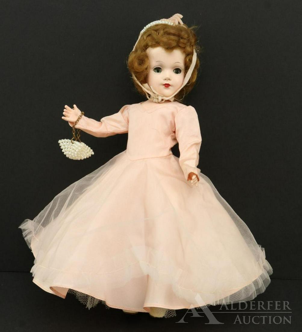 DOLLS OF THE 1950's-1960's.: Lot. 14" Marked MARY HOYER hard plastic doll in tagged outfit. Honey blonde uncombed hair. Dressed in pink taffeta gown with pink tulle over skirt. Tagged Jean Styles white satin panty with sequin dec