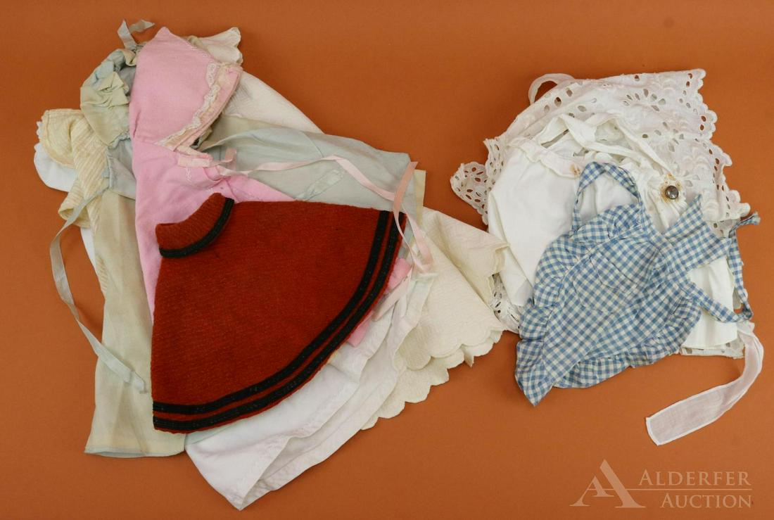 LOT OF ANTIQUE/VINTAGE CLOTHING.: Lot of antique doll clothes. (6) Capes, inc. (3) that are hooded. Cotton and wool. (3) Aprons/pinafores inc. (1) from an old Raggedy Ann doll. Child's organdy apron. Pink/white gingham bodice. Conditi