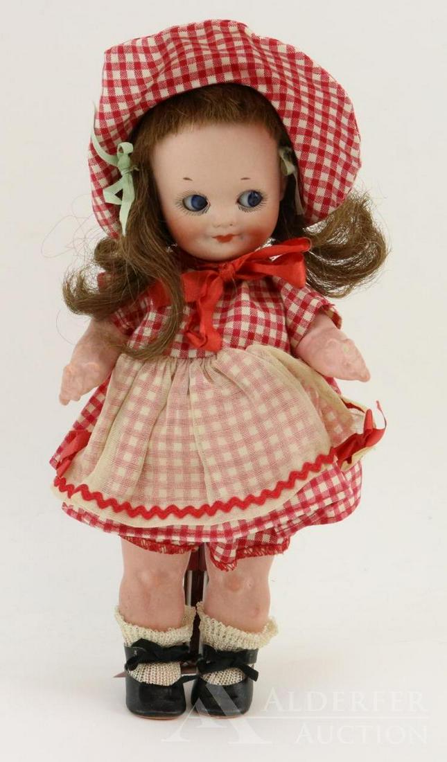 GERMAN BISQUE HEAD DOLLS 12" AND UNDER.: 9" ARMAND MARSEILLE GERMANY 323 A.6/0.M Googly eye character doll. Blue sleep eyes, closed mouth, brown human hair wig. 5 Pc. papier mache body. Dressed in vintage red/white check dress with matching