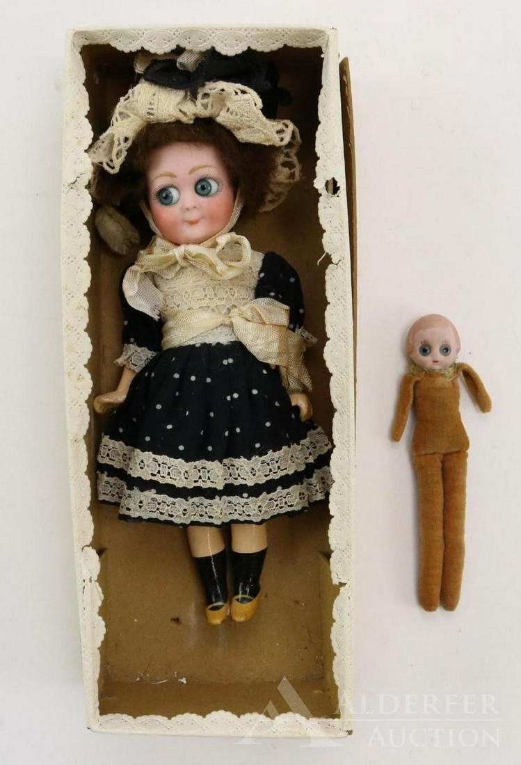 GERMAN BISQUE HEAD DOLLS 12" AND UNDER.: Pair of Googly eye character dolls. Both dolls have blue glass eyes. Doll 1) 8 1/2" B X P 608 1/0 Doll has side glance eyes, watermelon smile, brown mohair wig. 5 Pc. papier mache body with painted sh