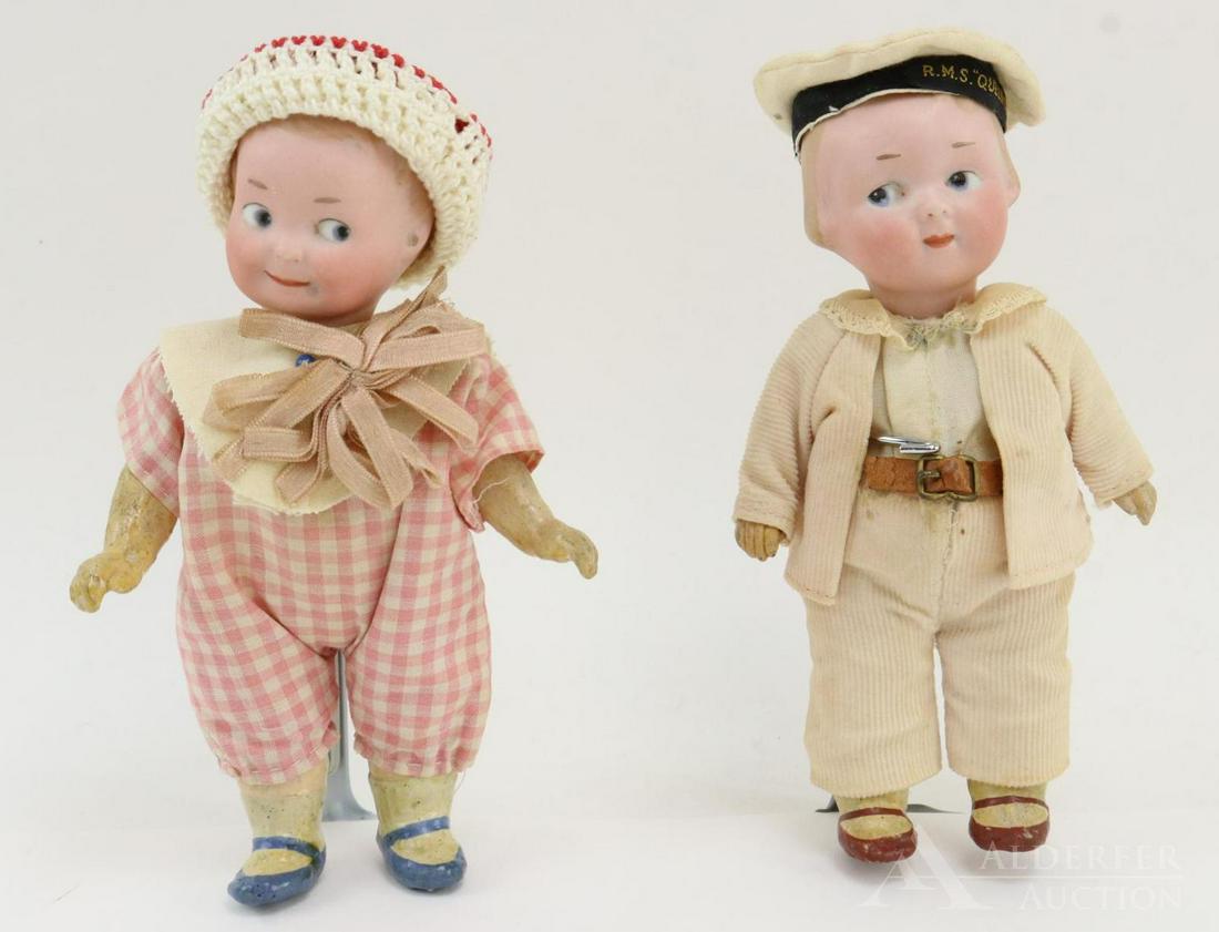 GERMAN BISQUE HEAD DOLLS 12" AND UNDER.: Pair of solid dome Googly eye character dolls. Both dolls have blue integlio eyes, closed mouths, painted blonde hair, 5 pc. papier mache bodies with painted shoes. (2) Stands. Doll 1) 6" 2/0 A.10/0.M