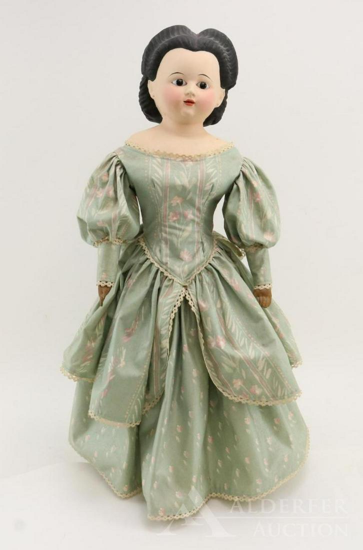 LOT OF PAPIER MACHE DOLL(S).: 25" Unmarked shoulder head doll. Stationary black pupiless eyes, open mouth. Black molded/painted center part hair. Antique cloth body with lower arms that have been varnished? Dressed in contemporary