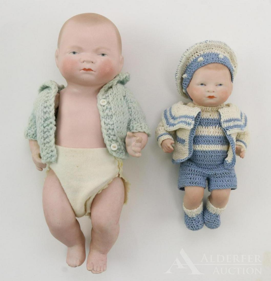 LOT OF ALL BISQUE DOLLS.: Pair of Byelo Babies. Both have solid domes, painted features inc. blue eyes, 5 pc. bent limb baby bodies,. Doll 1) 7 1/2" 20-20 is an antique. Light brown hair. Wearing a pale green sweater and diape