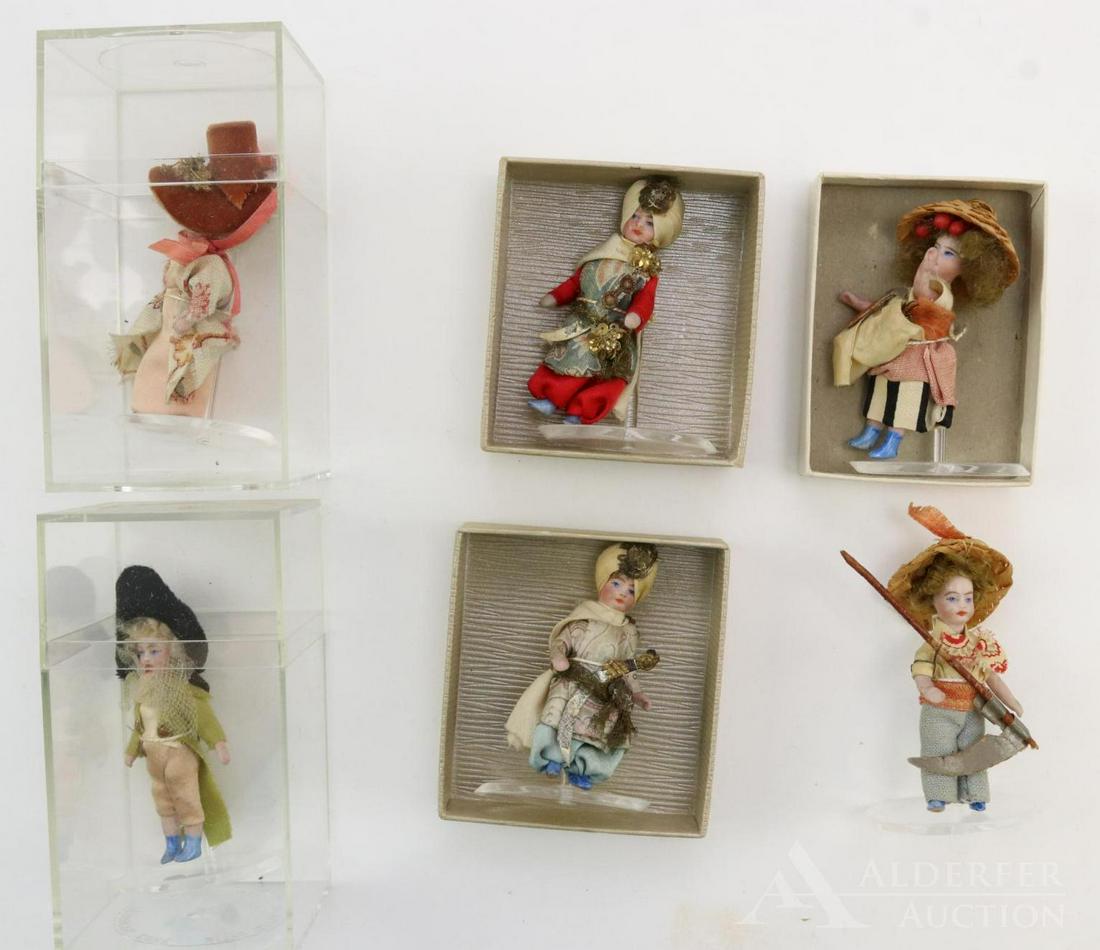 LOT OF ALL BISQUE FRENCH/TYPE DOLLS.: This is an original family owned lot. Set of (6) all original 2 1/2" "Les Lilliputiens", 1912, with blue boots. Each comes with a stand.