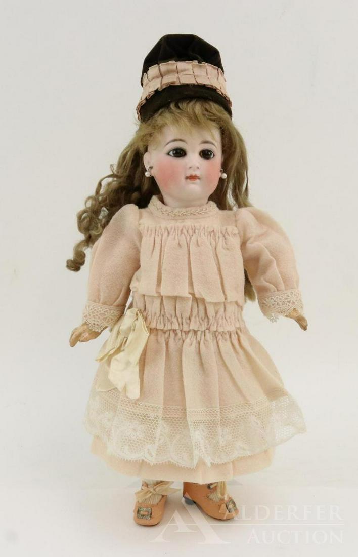ANTIQUE GERMAN BISQUE HEAD DOLL.: 12 1/2" CLOVERLEAF SYMBOL "6" Doll. Stationary brown eyes, closed mouth with slight space between lips, pierced ears, long brown curly floss wig. French style papier mache jointed body with 1 pc. lowe