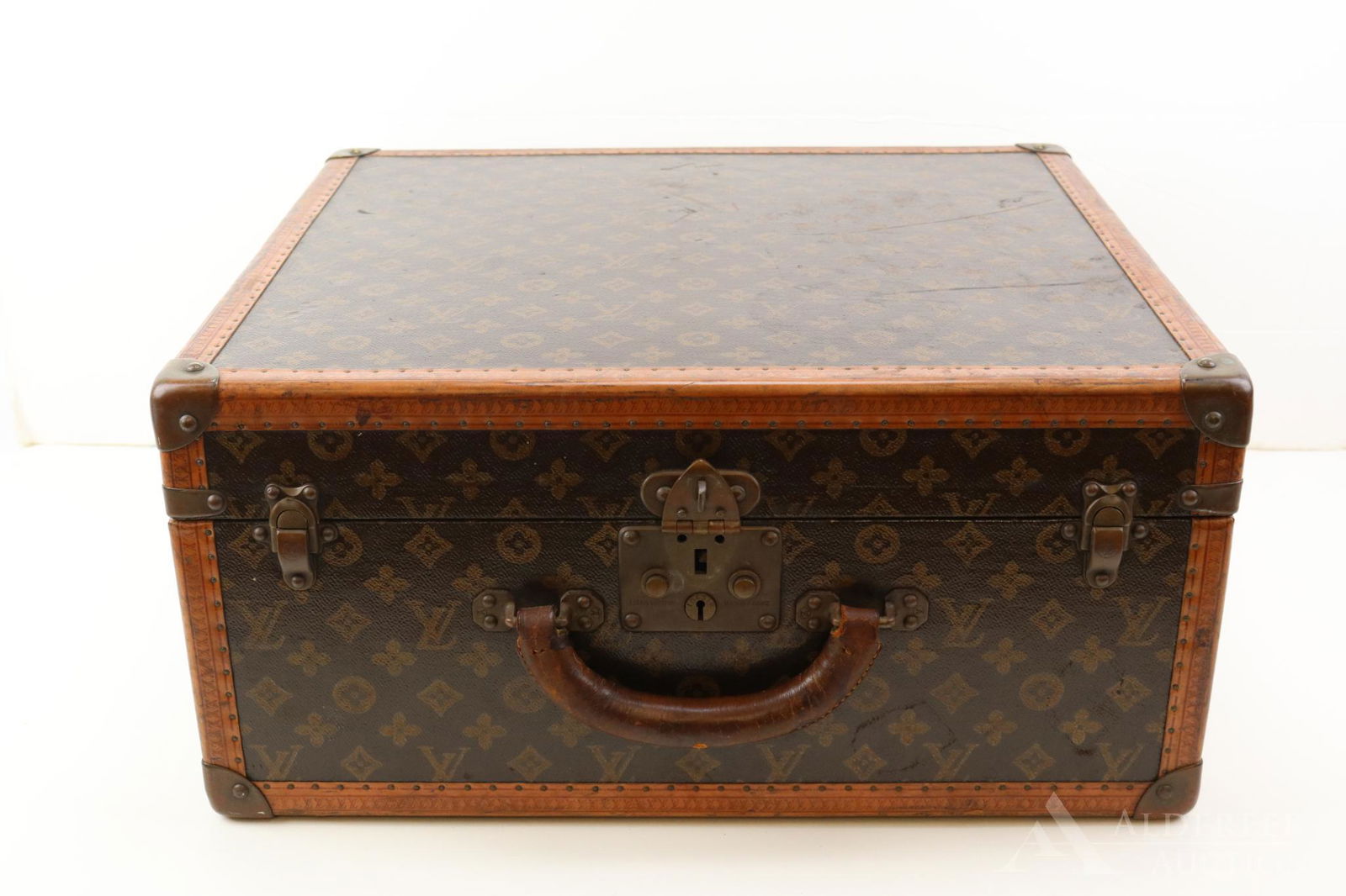 Louis Vuitton Monogram Travel Case: Monogram canvas with reinforced brass corners and single handle. Brass clasp stamped Louis Vuitton, Made in France no. 104519, key with same number stamp. Inside lid has attached flap with snap clo