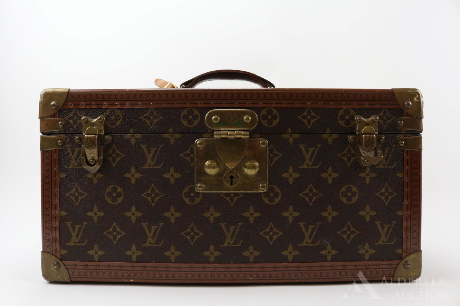 Louis Vuitton Monogram Beauty Case: Monogram canvas with reinforced brass corners, single handle with luggage tag. Brass clasp stamped Louis Vuitton, Made in France no. 1082189, original key with same number stamp. Interior with remova