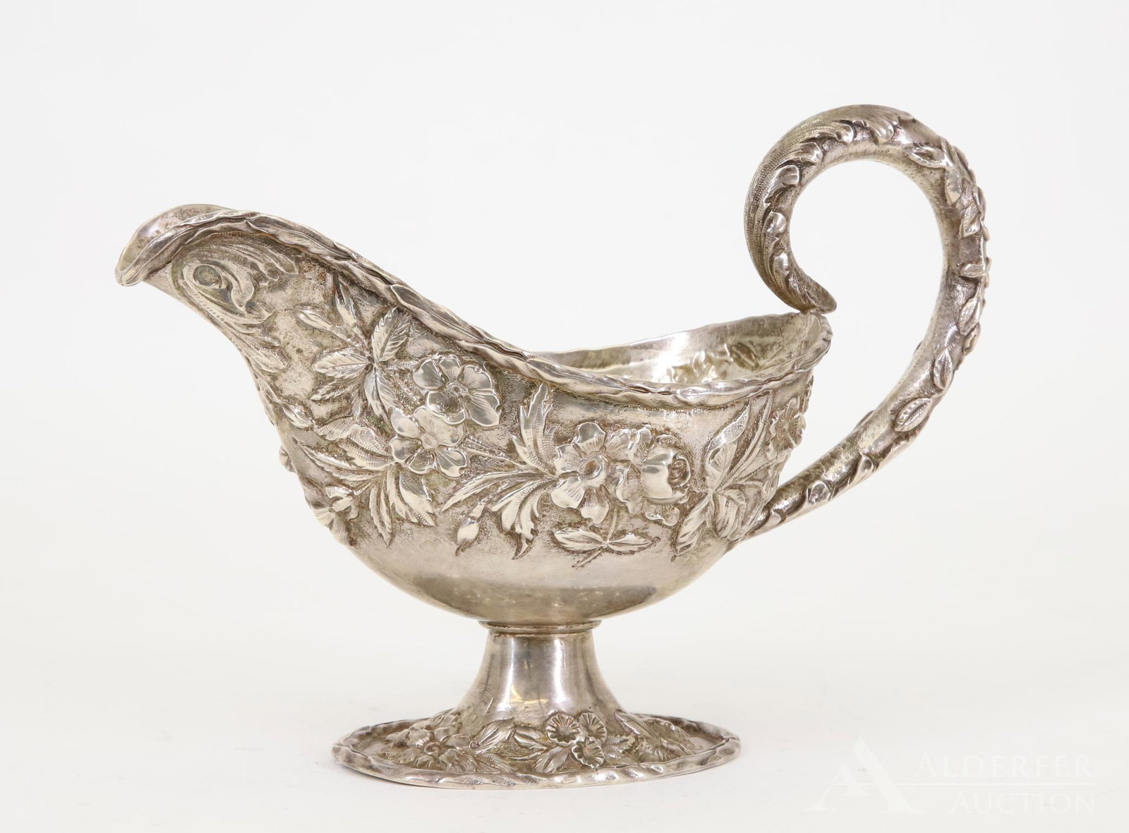 S. Kirk & Sons Sterling Silver Sauce Boat: S. Kirk & Sons sterling silver sauce boat with floral decoration throughout. Model #58. 6.25"h x 8.5"w and 10.1ozt